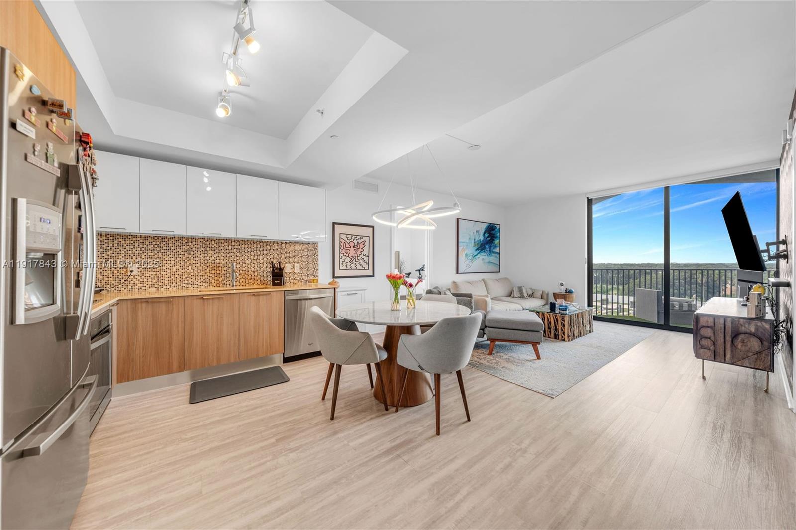 5252 Northwest 85th Avenue, Unit 504 Doral, FL 33166 - Photo 4 of 31 a view of a dining room with furniture window and wooden floor