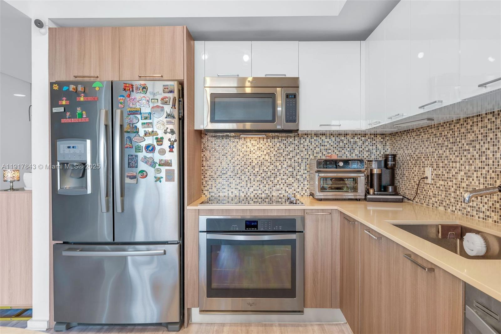 5252 Northwest 85th Avenue, Unit 504 Doral, FL 33166 - Photo 8 of 31 a kitchen with stainless steel appliances granite countertop a refrigerator and a sink