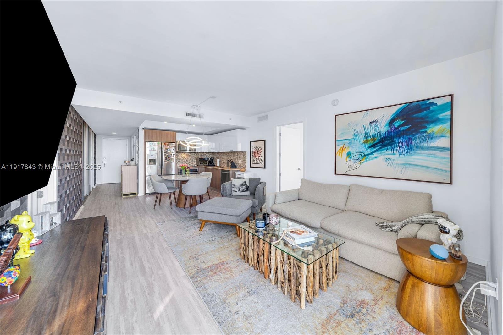5252 Northwest 85th Avenue, Unit 504 Doral, FL 33166 - Photo 10 of 31 a living room with furniture and wooden floor