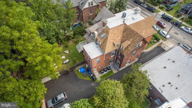 an aerial view of a house with a yard
