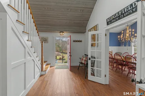 a view of entryway with wooden floor