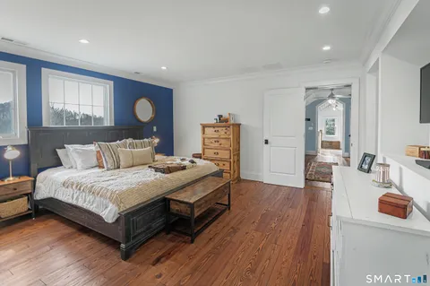 a spacious bedroom with a bed and window
