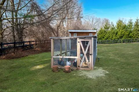 a view of outdoor space with deck and yard