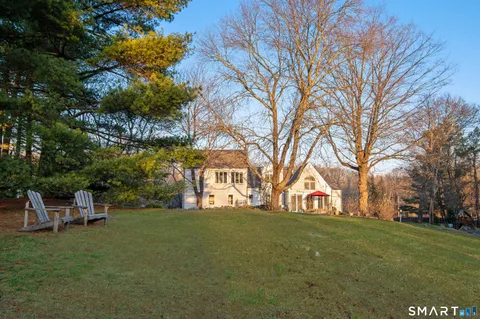 a view of a house with a back yard