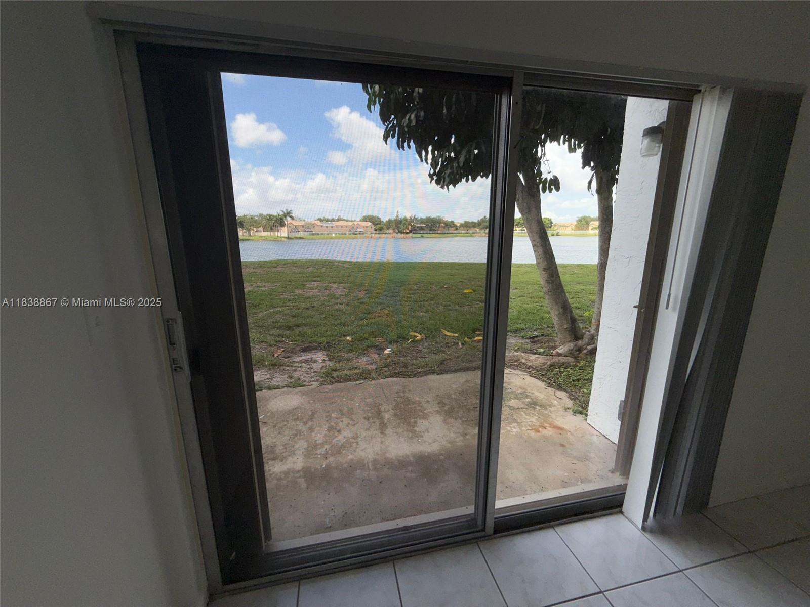 8560 Sherman Circle North, Unit 105 Miramar, FL 33025 - Photo 2 of 14 a view of backyard from window