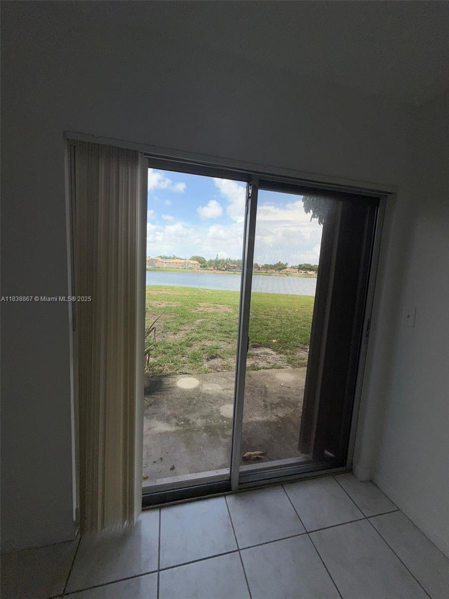 8560 Sherman Circle North, Unit 105 Miramar, FL 33025 - Photo 3 of 14 a view of an empty room and window
