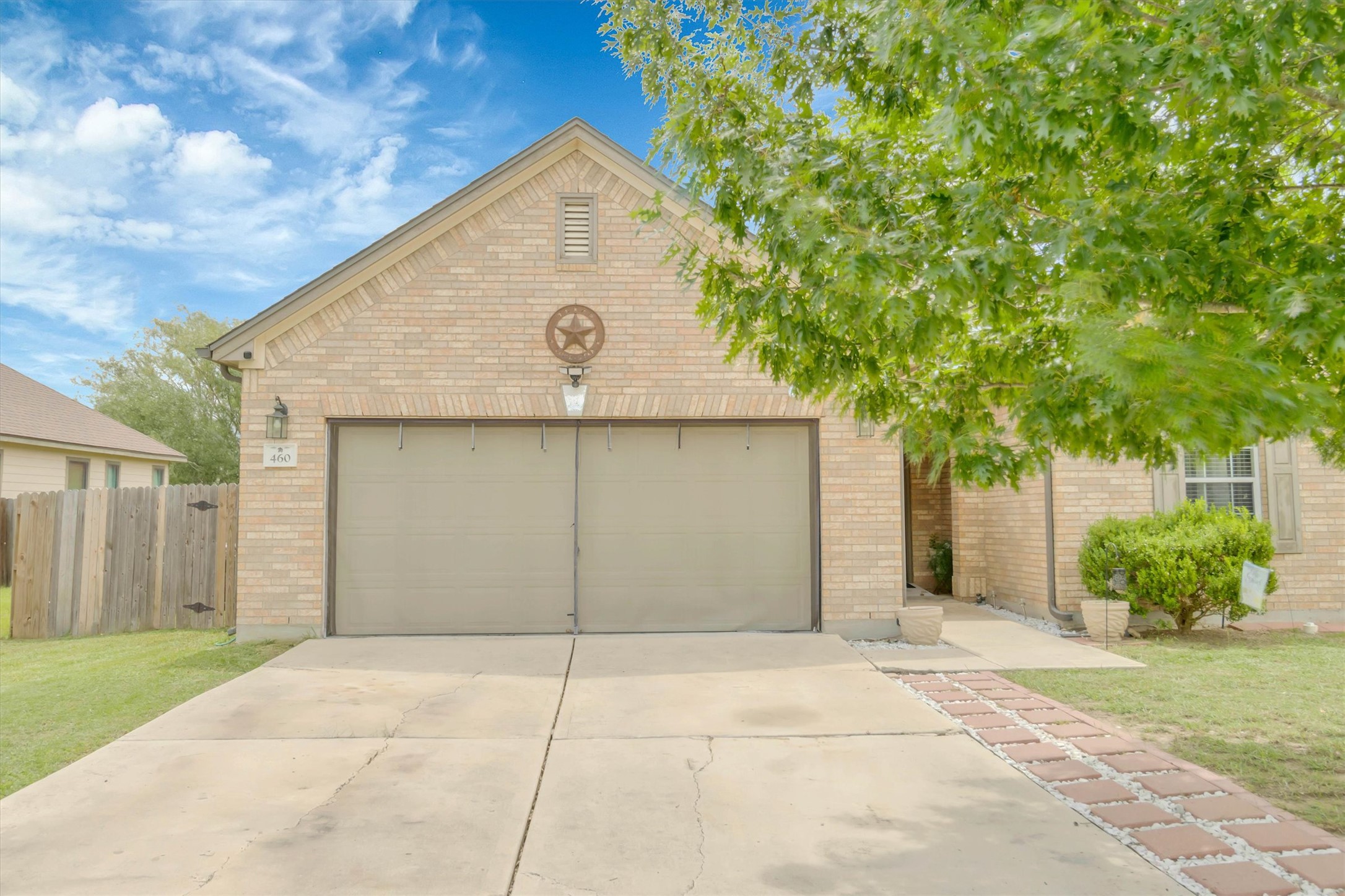 460 Waterleaf Boulevard Kyle, TX 78640 - Photo 2 of 30 A classic brick facade with an integrated garage and a welcoming walkway.