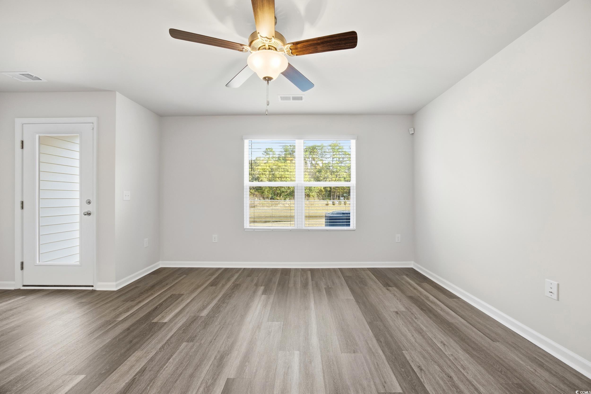 322 Honeystone Street Conway, SC 29526 - Photo 11 of 30 Unfurnished room featuring wood finished floors and a ceiling fan