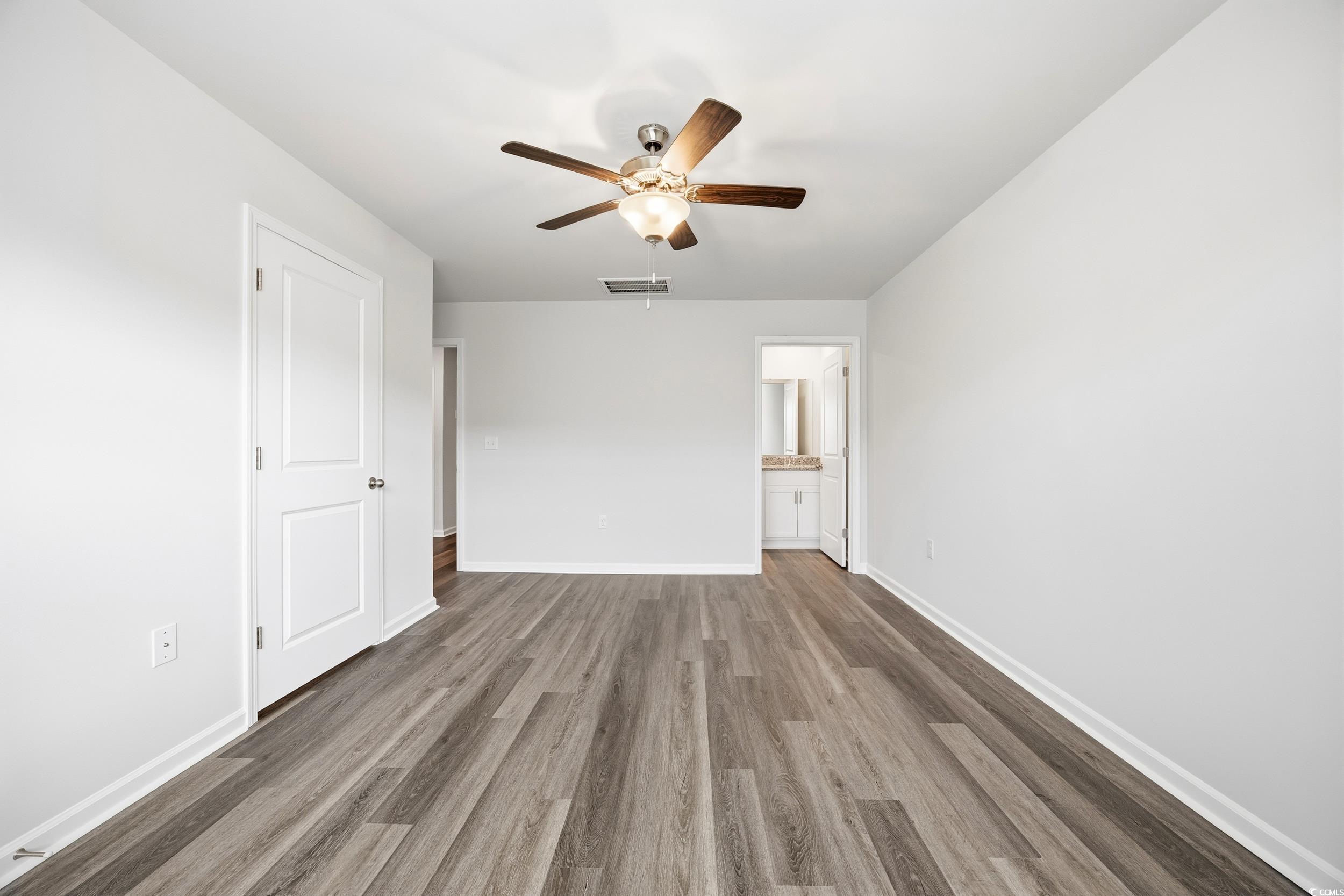 322 Honeystone Street Conway, SC 29526 - Photo 14 of 30 Spare room with wood finished floors and ceiling fan
