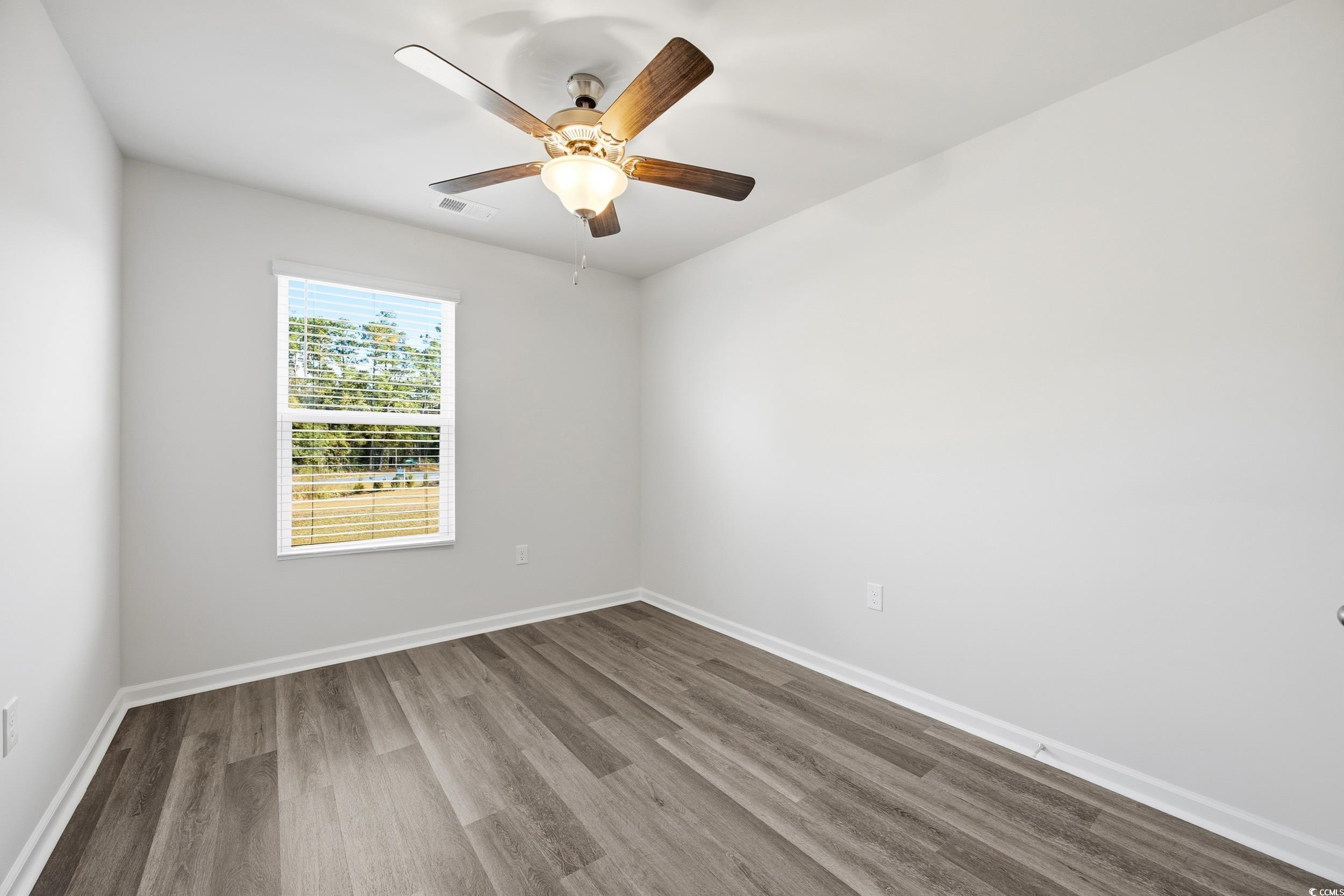 322 Honeystone Street Conway, SC 29526 - Photo 22 of 30 Spare room with wood finished floors and a ceiling fan