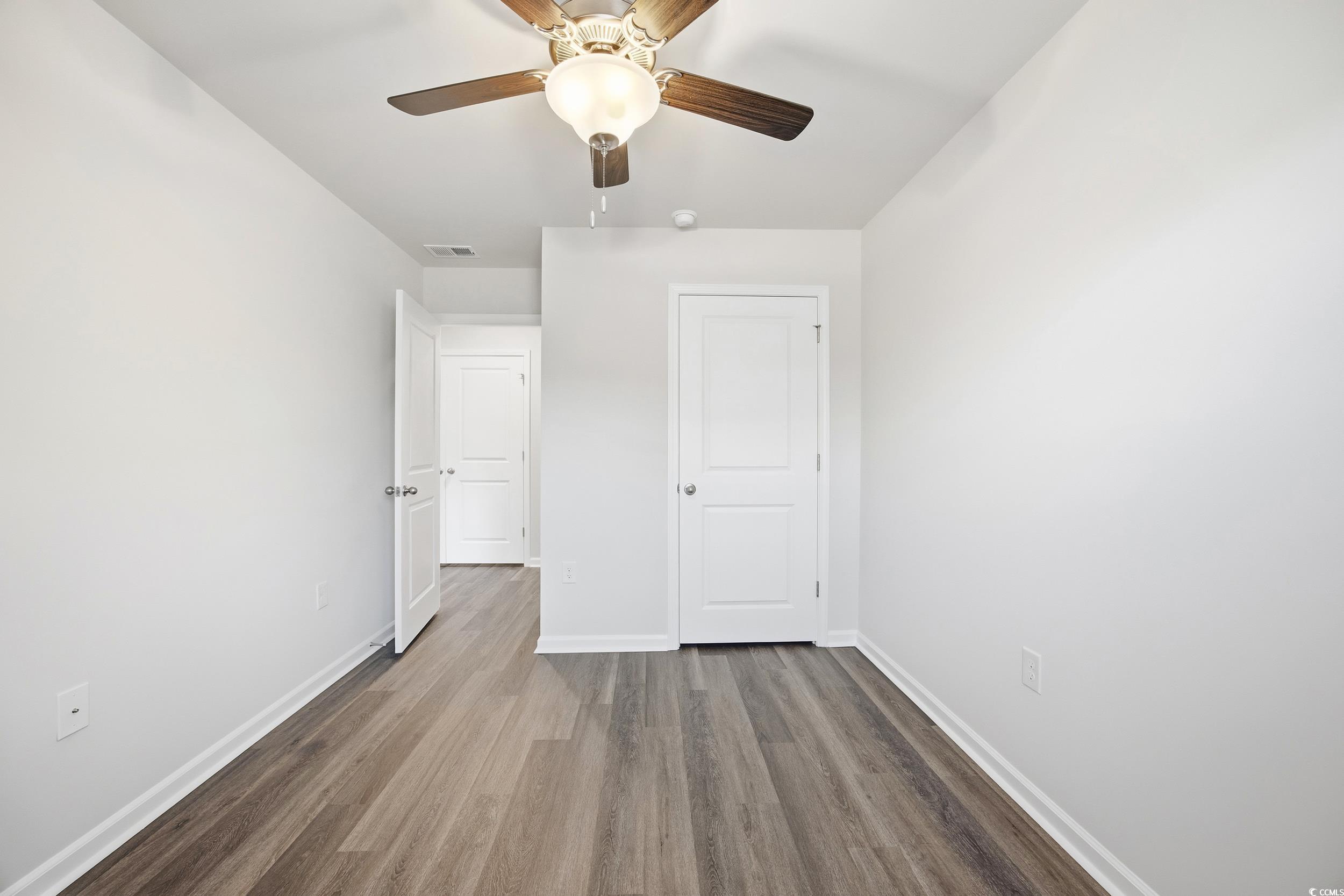 322 Honeystone Street Conway, SC 29526 - Photo 23 of 30 Unfurnished bedroom featuring wood finished floors and a ceiling fan