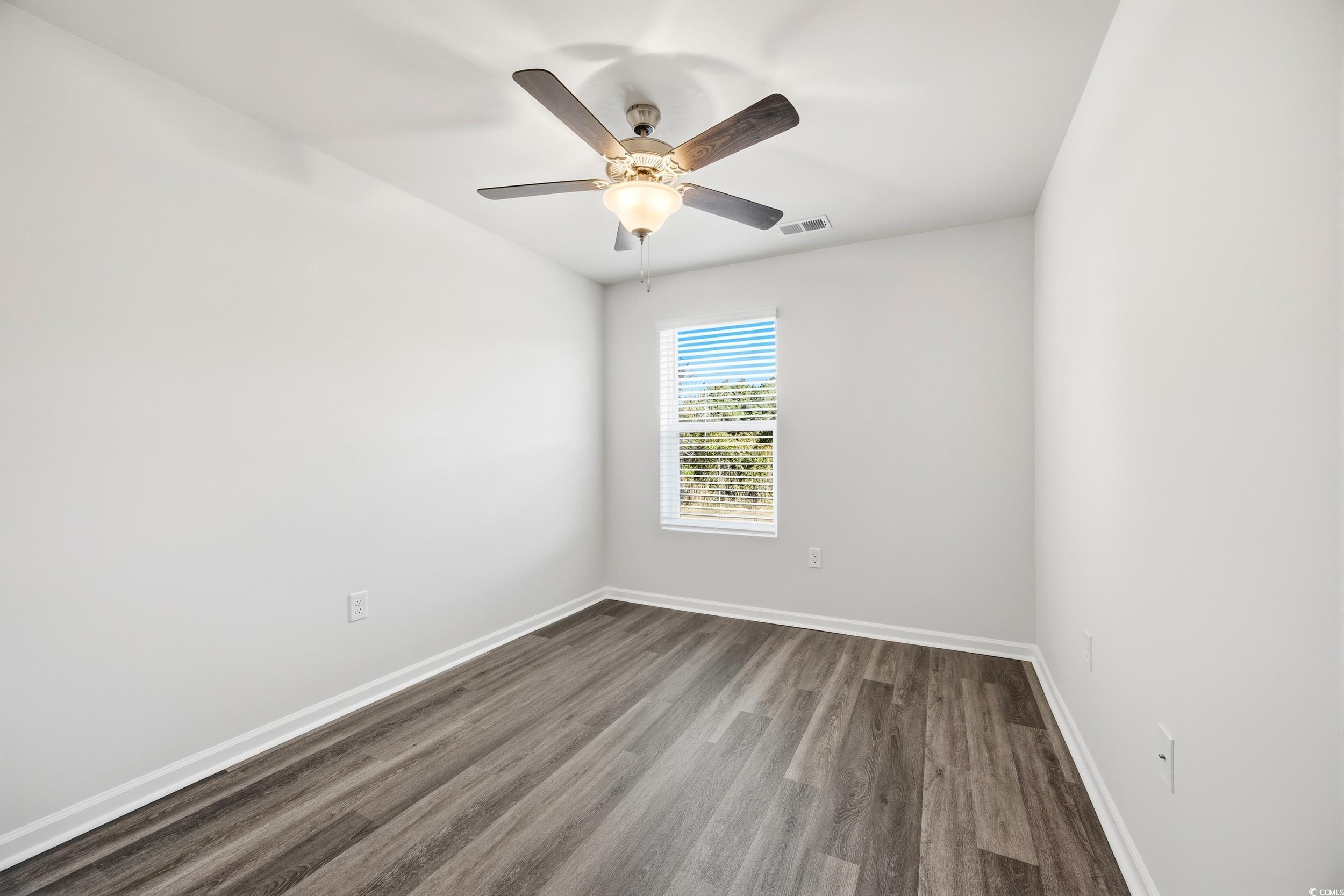 322 Honeystone Street Conway, SC 29526 - Photo 24 of 30 Empty room with wood finished floors and ceiling fan