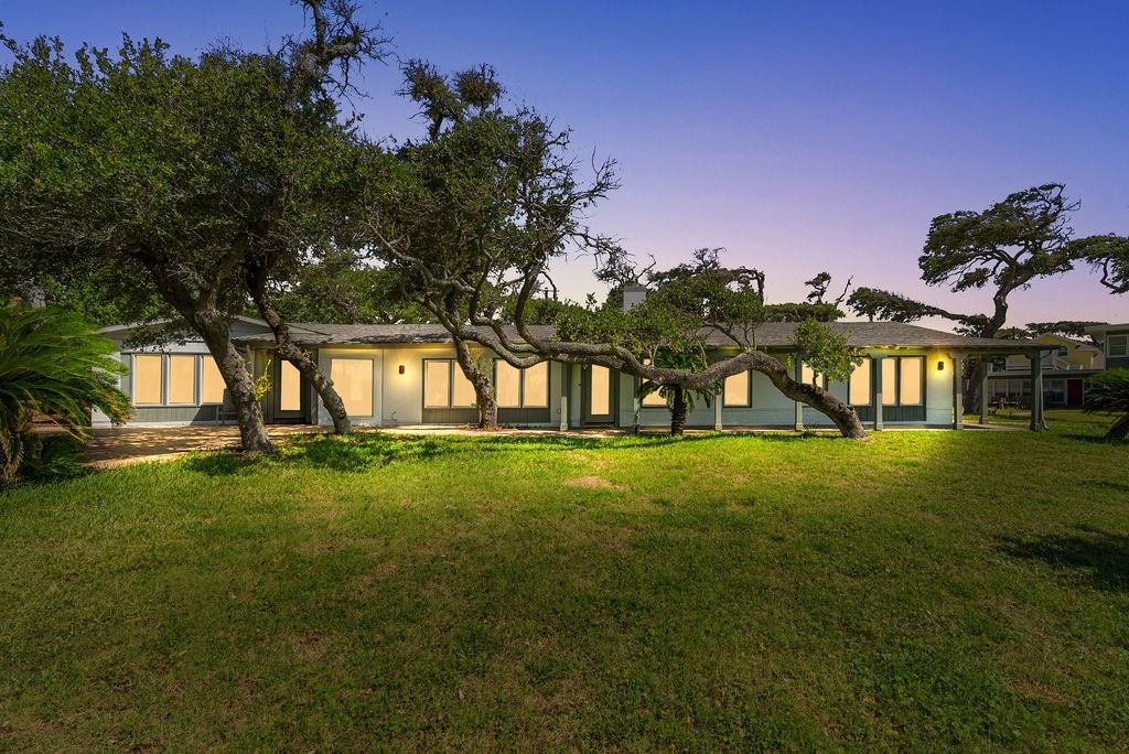 1931 North Fulton Beach Road Rockport, TX 78382 - Photo 1 of 40 a view of an house with backyard space and garden