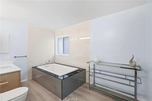 a bathroom with a sink toilet and vanity