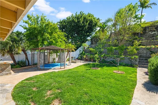 a view of a house with a yard porch and sitting area