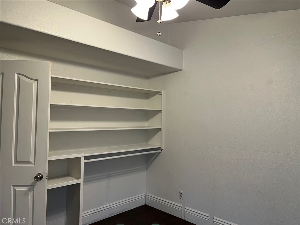 34667 Borchard Road, Unit R Lake Elsinore, CA 92530 - Photo 8 of 20 a view of walk in closet with empty racks