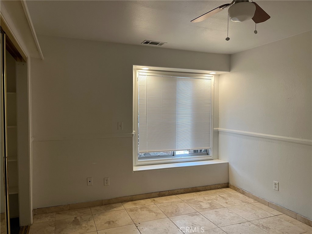 34667 Borchard Road, Unit R Lake Elsinore, CA 92530 - Photo 9 of 20 a view of an empty room with a window