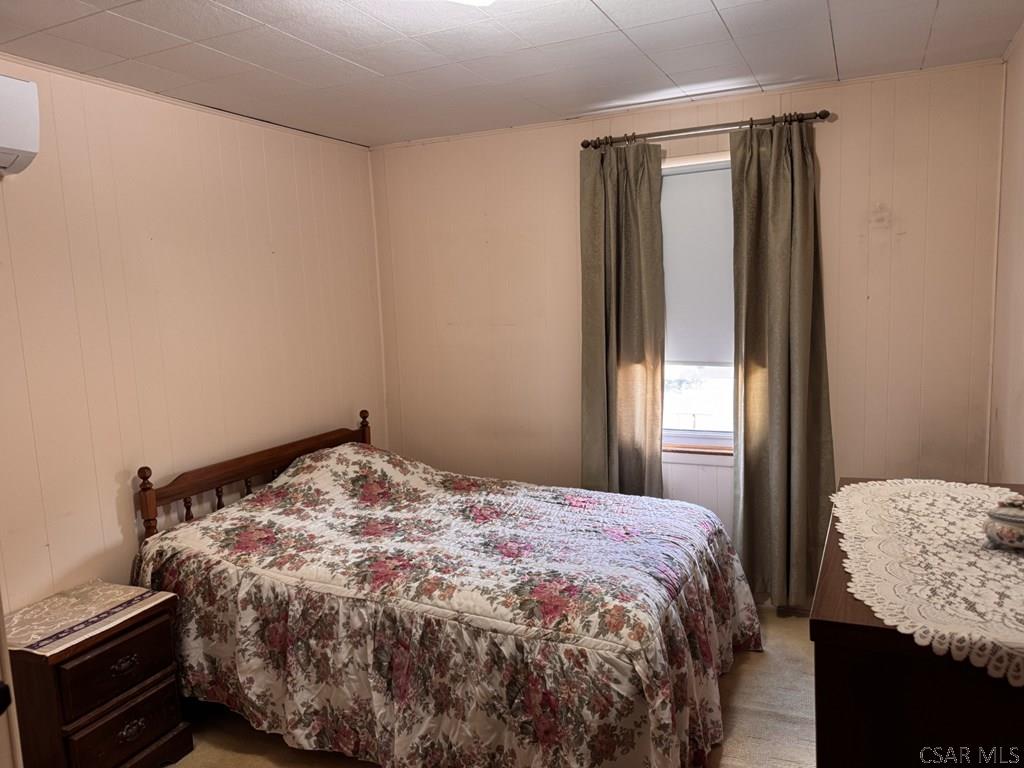 139 Reed Street Elmora, PA 15737 - Photo 15 of 23 a bedroom with a bed and a window