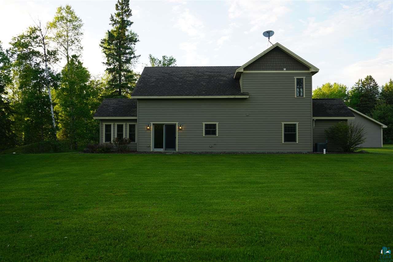 66 East Harney Road Esko, MN 55733 - Photo 36 of 46 Sliding doors from the dining room lead you to this great yard space and fire ring.