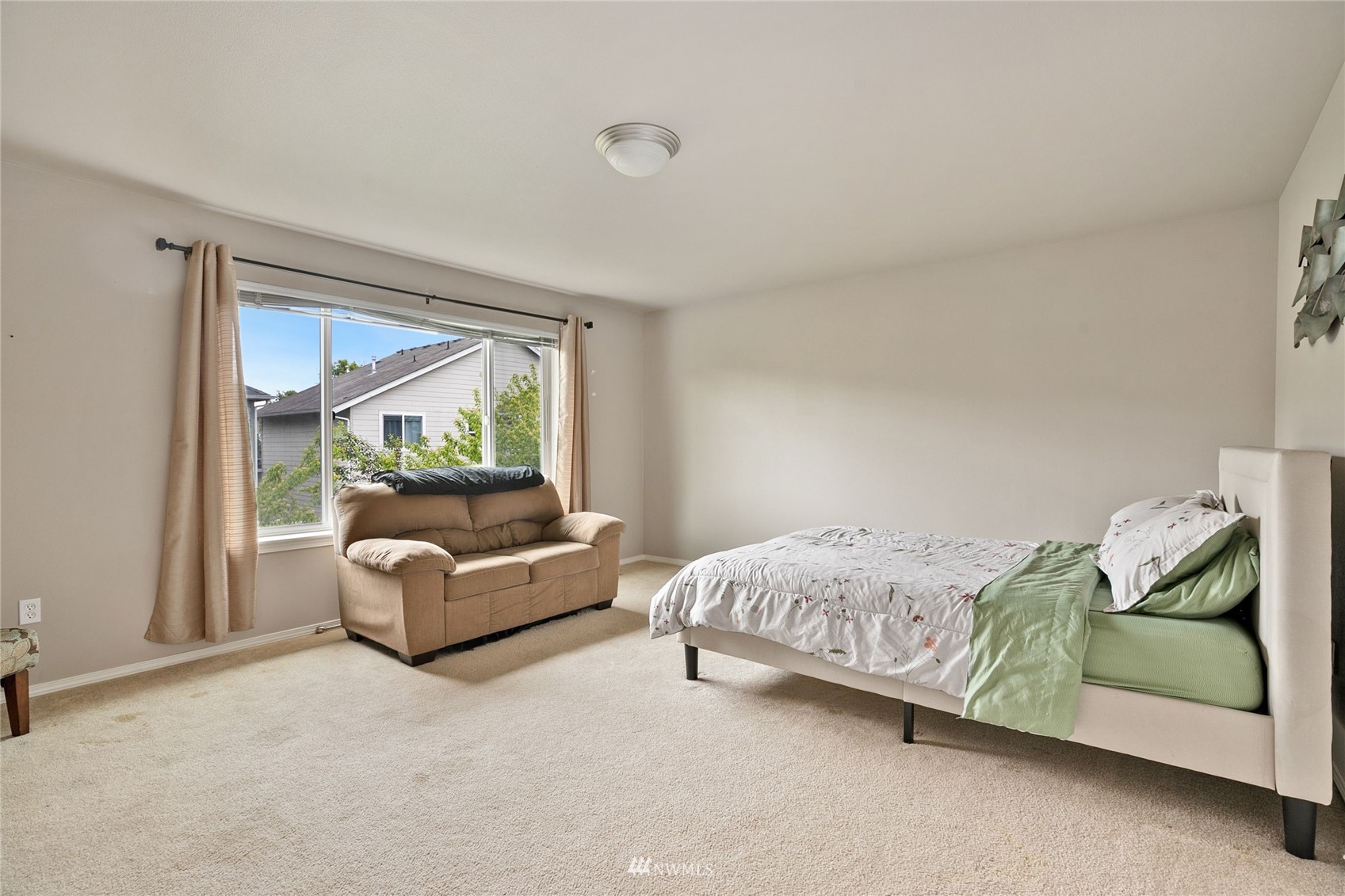6924 Inlay Street Southeast Lacey, WA 98513 - Photo 11 of 20 a bedroom with a bed and a couch