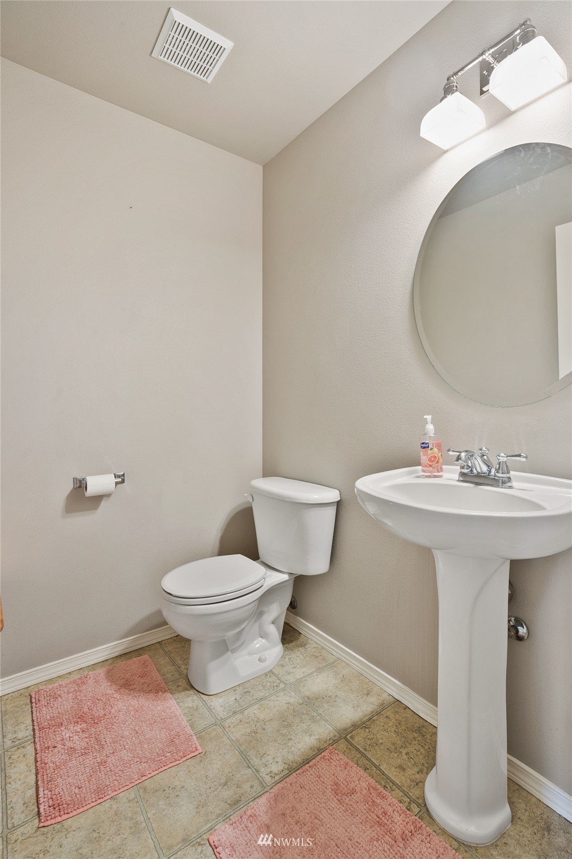 6924 Inlay Street Southeast Lacey, WA 98513 - Photo 10 of 20 a bathroom with a sink toilet and a mirror