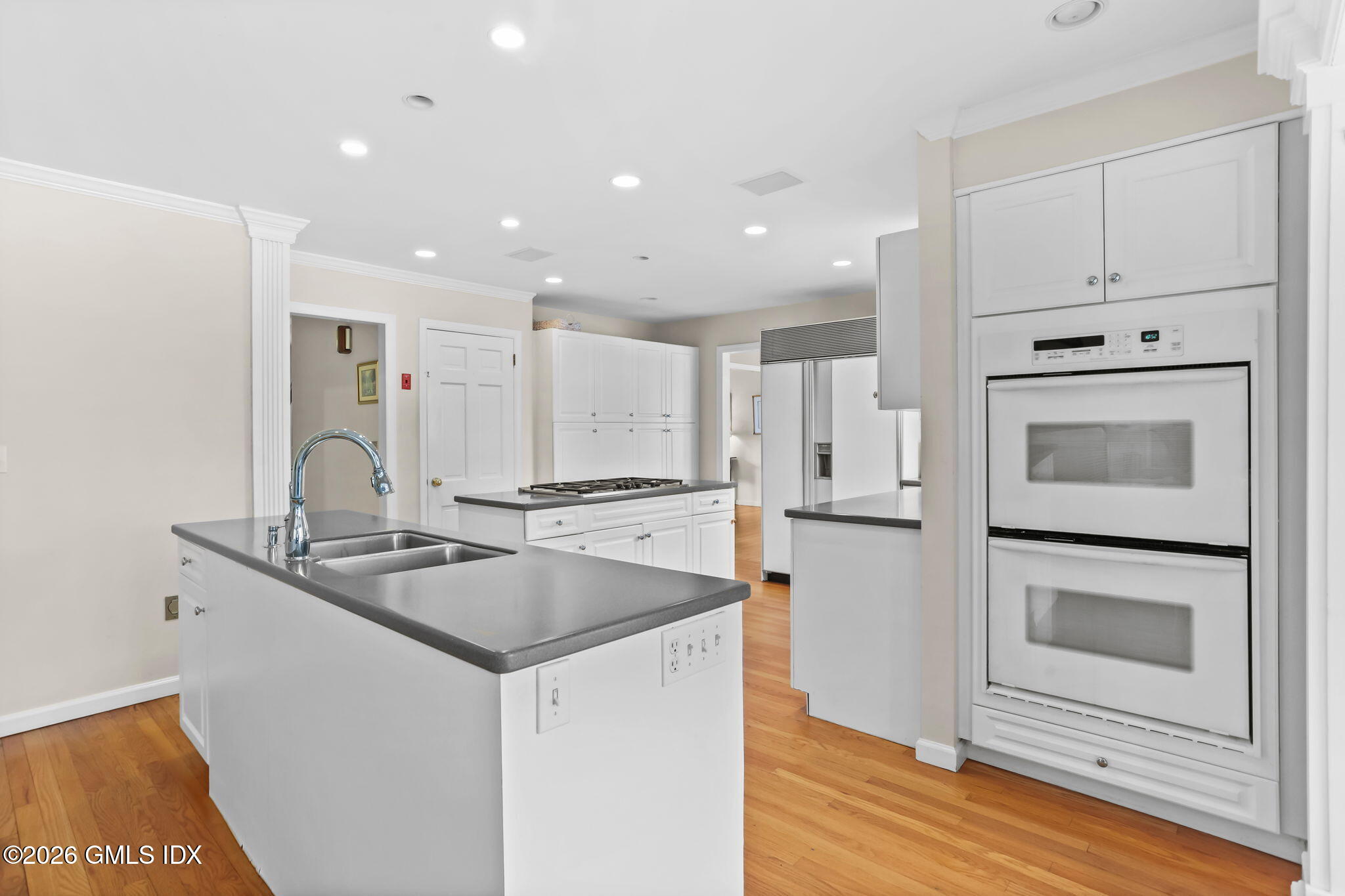 153 Lockwood Road Riverside, CT 06878 - Photo 19 of 58 a kitchen with stainless steel appliances granite countertop a sink and a stove