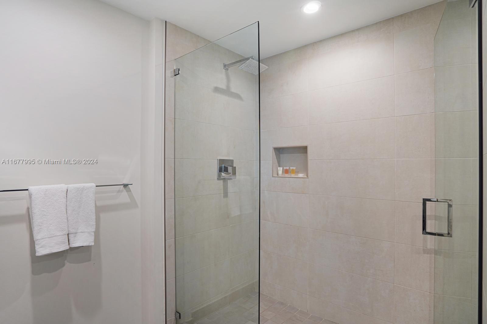 South Central Beach Hollywood, FL 33019 - Photo 6 of 23 a bathroom with a shower