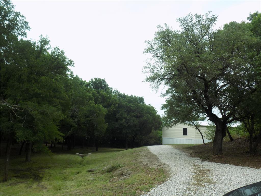 203 South Ridgeview Court Azle, TX 76020 - Photo 22 of 29 New gravel drive way.