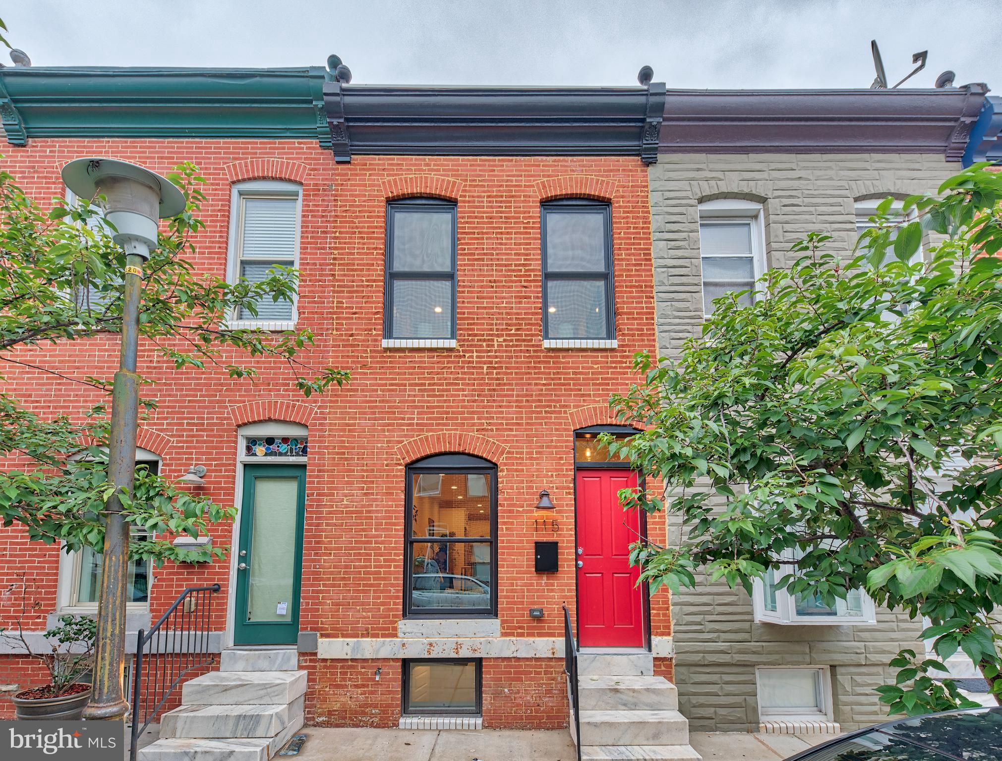 115 North Decker Avenue Baltimore, MD 21224 - Photo 1 of 30 a front view of a multi story residential apartment building