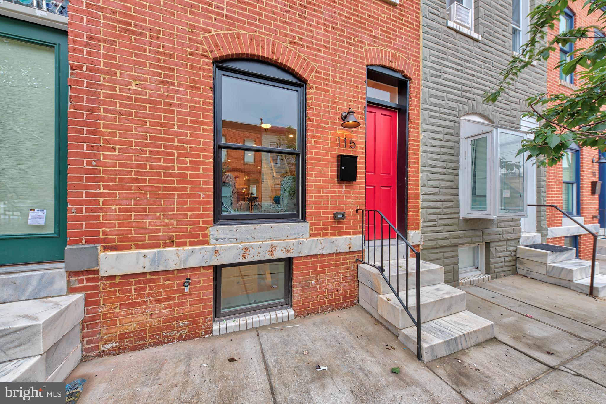 115 North Decker Avenue Baltimore, MD 21224 - Photo 2 of 30 a front view of a house with a outdoor space