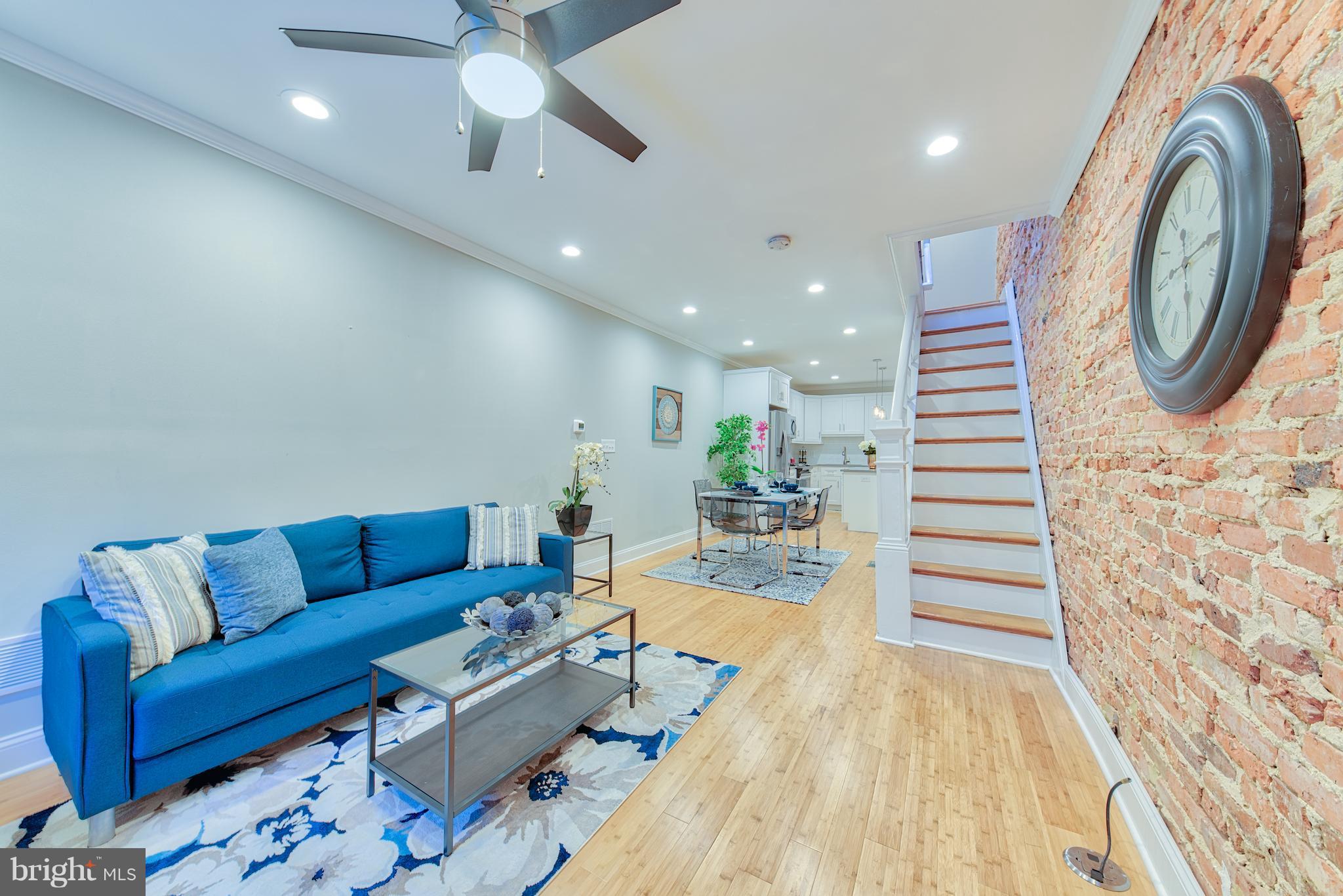 115 North Decker Avenue Baltimore, MD 21224 - Photo 3 of 30 a living room with furniture and a wooden floor