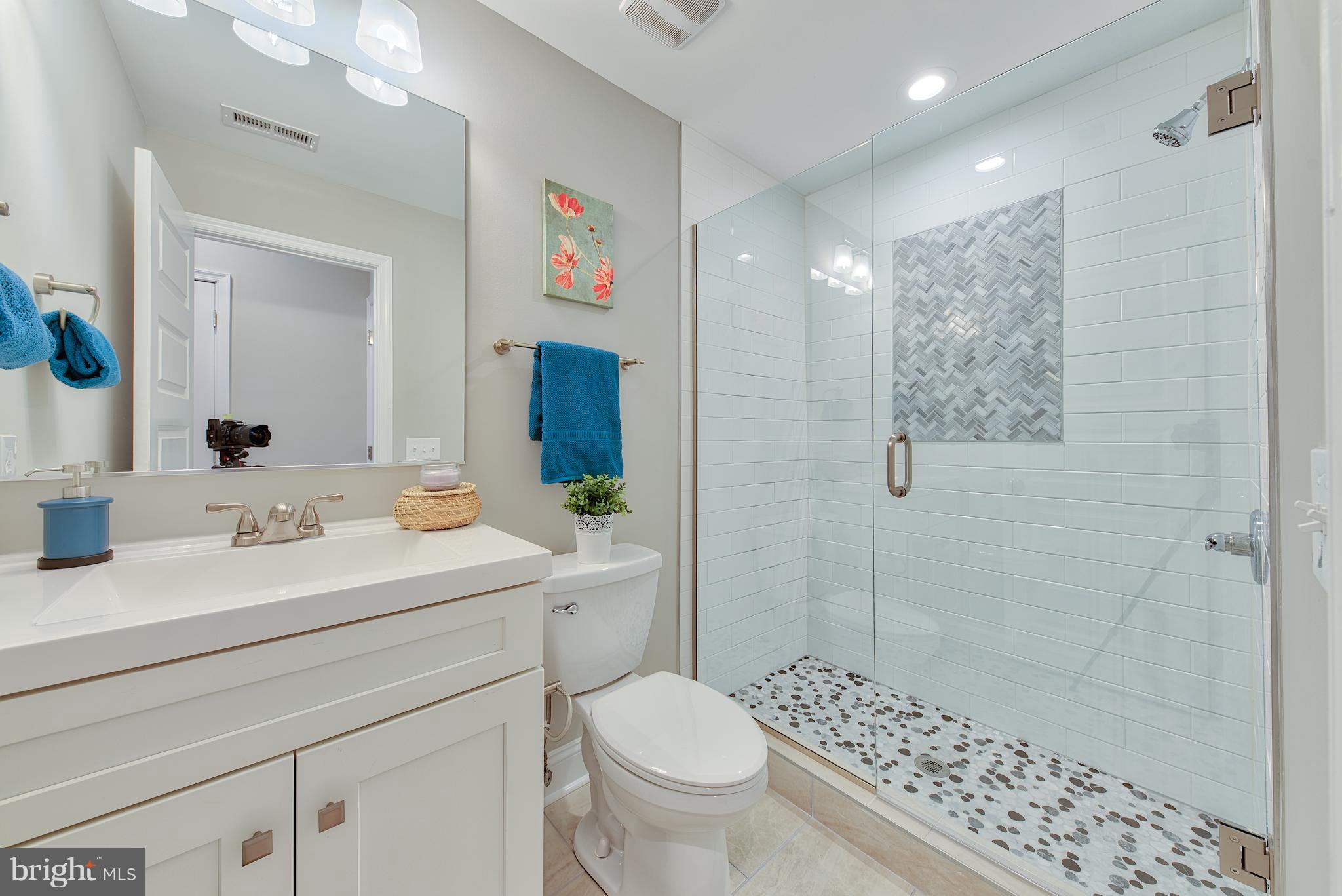 115 North Decker Avenue Baltimore, MD 21224 - Photo 26 of 30 a bathroom with a sink a toilet and shower