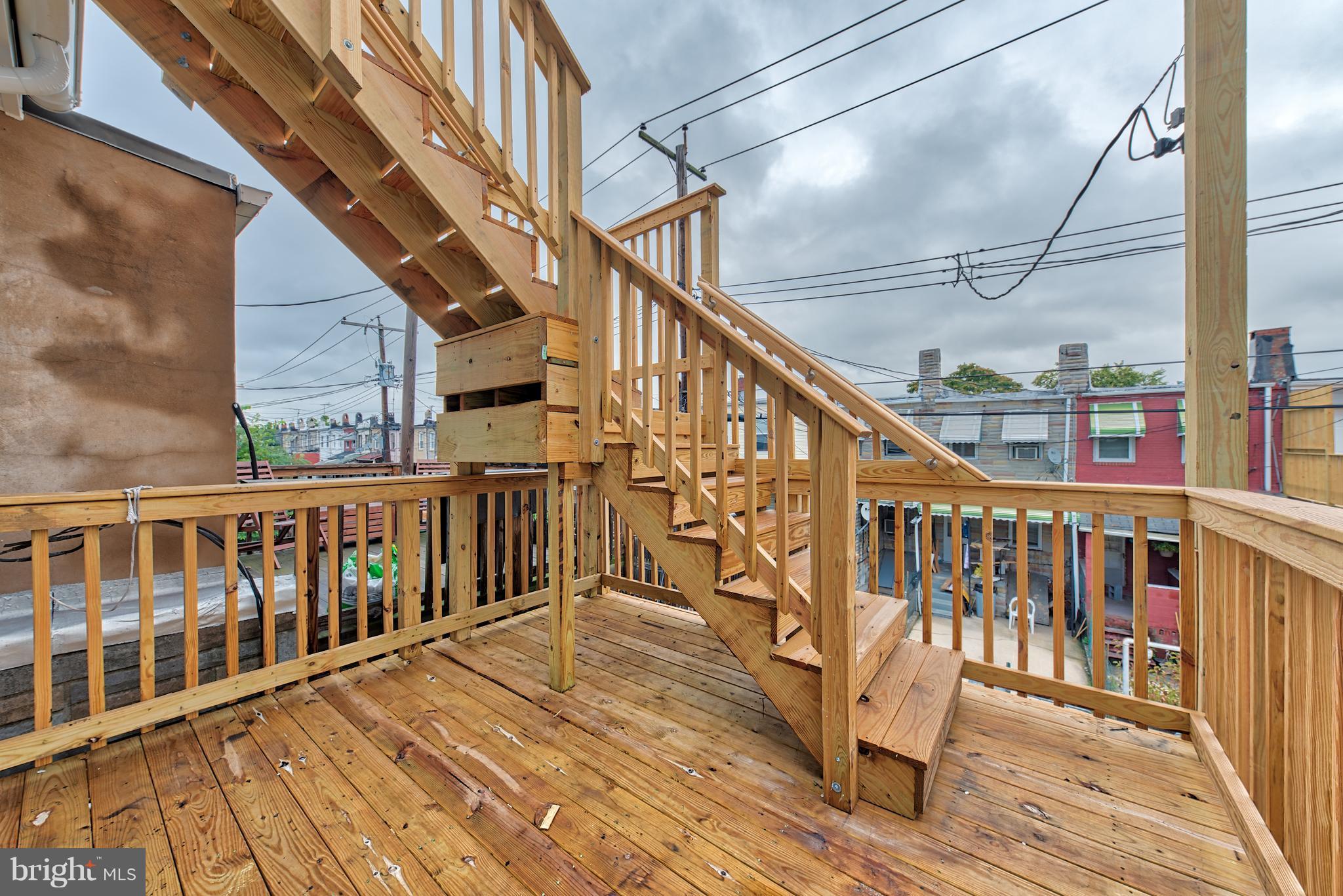 115 North Decker Avenue Baltimore, MD 21224 - Photo 27 of 30 a view of balcony with wooden floor