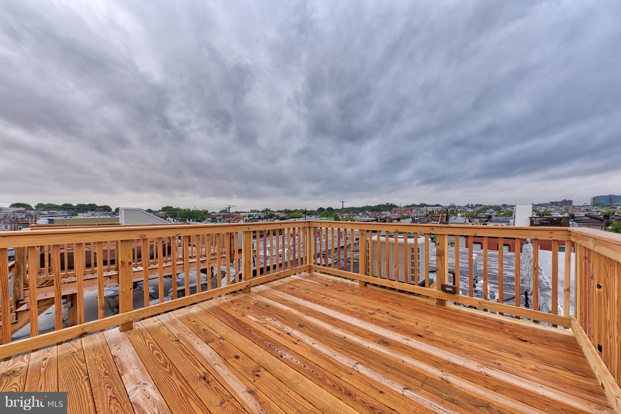 115 North Decker Avenue Baltimore, MD 21224 - Photo 28 of 30 a view of a balcony with wooden floor