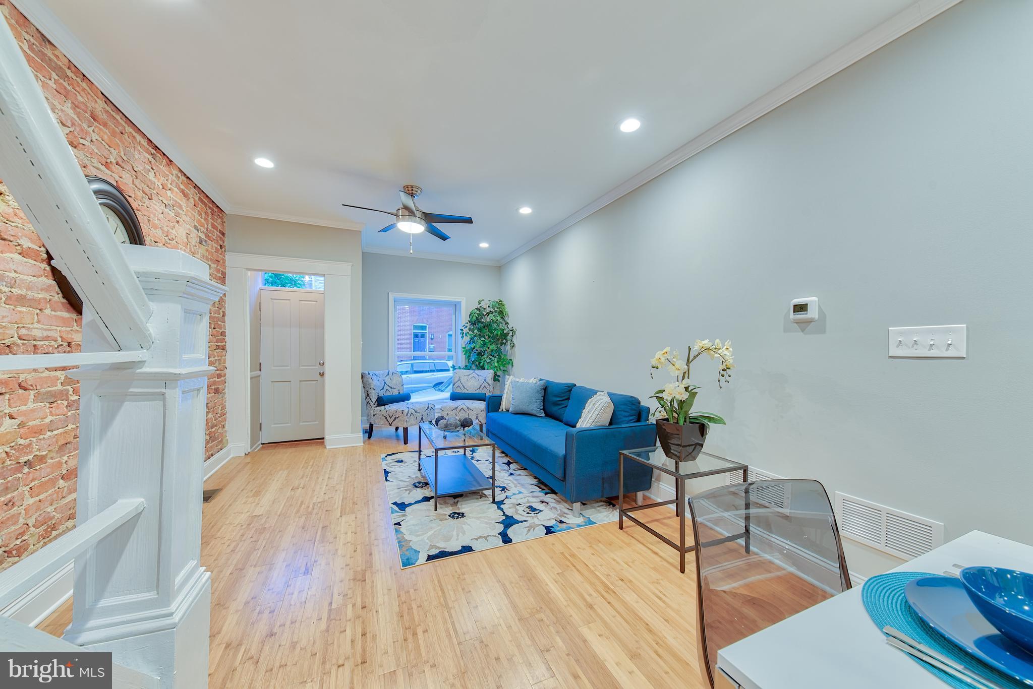 115 North Decker Avenue Baltimore, MD 21224 - Photo 5 of 30 a living room with furniture and wooden floor