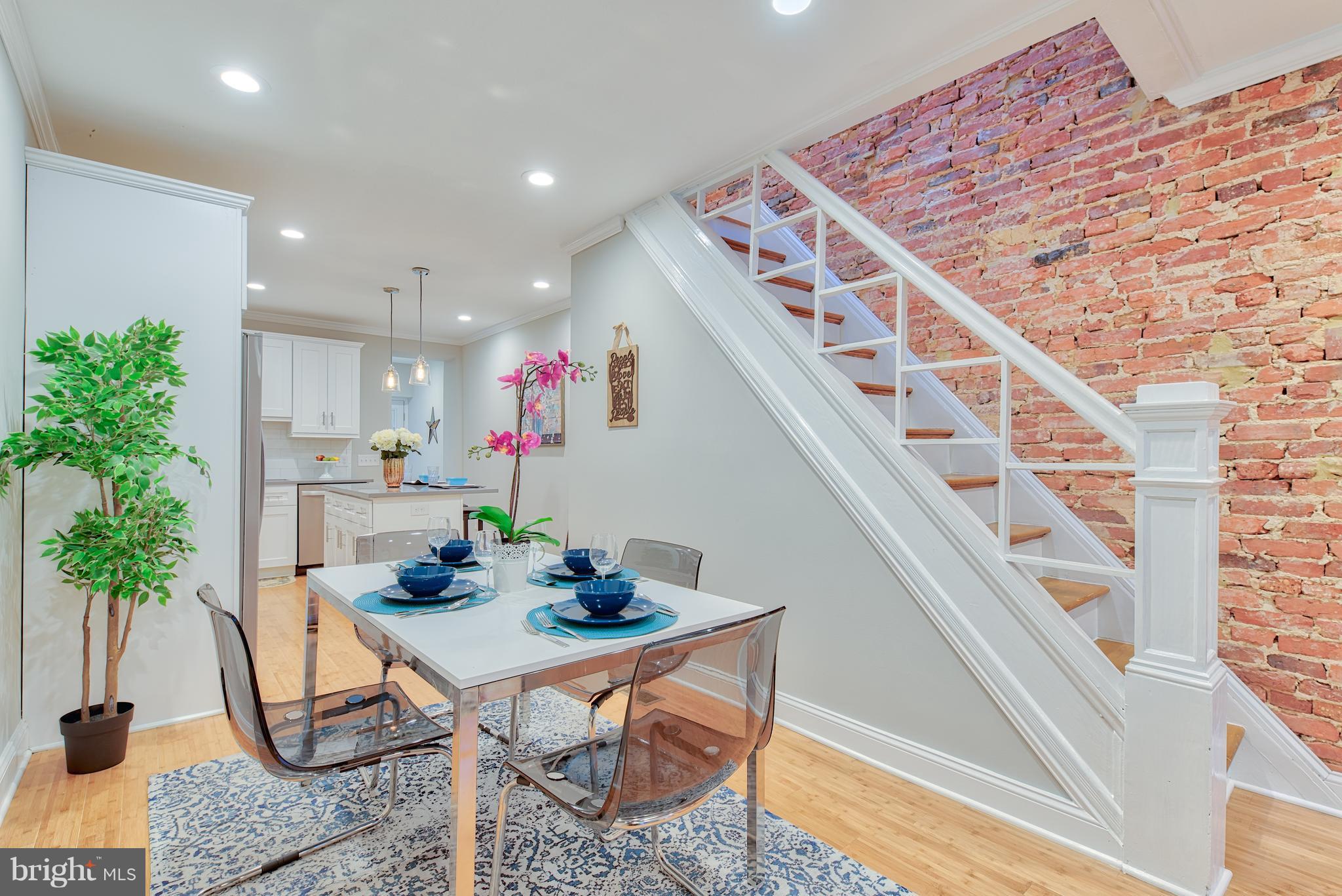 115 North Decker Avenue Baltimore, MD 21224 - Photo 7 of 30 a dining room with furniture and potted plants