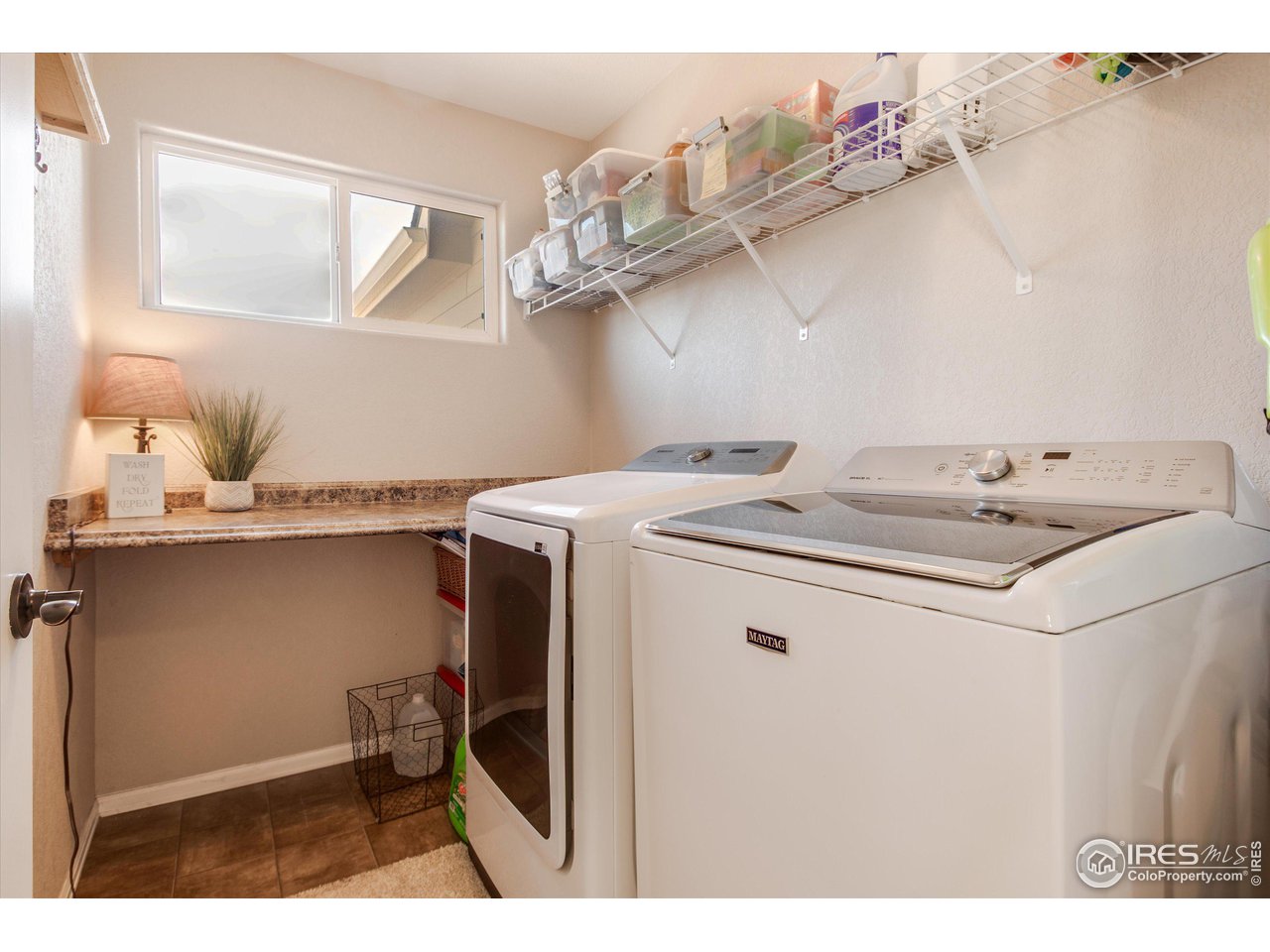 5771 Mountain Shadows Boulevard Firestone, CO 80504 - Photo 18 of 40 a utility room with dryer and washer