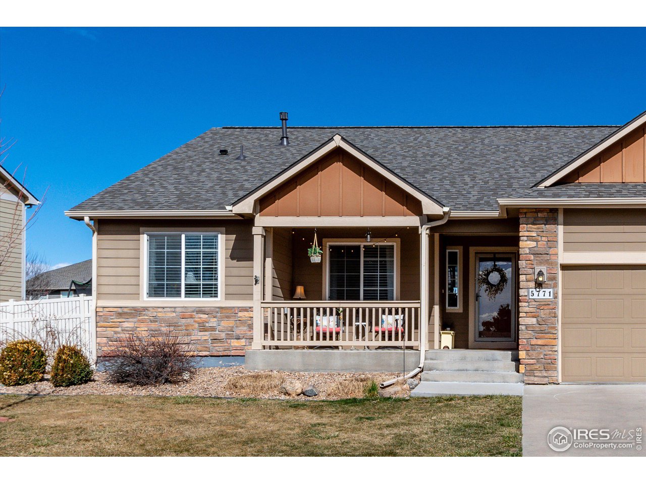 5771 Mountain Shadows Boulevard Firestone, CO 80504 - Photo 2 of 40 a front view of a house with a yard