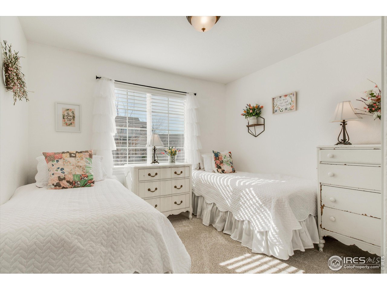 5771 Mountain Shadows Boulevard Firestone, CO 80504 - Photo 26 of 40 a bedroom with a bed and a window