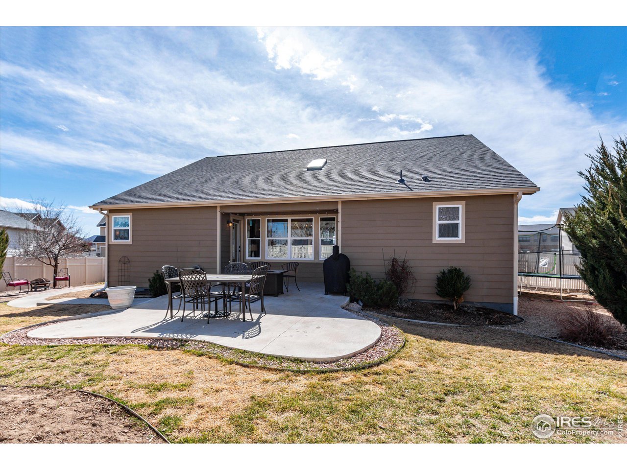 5771 Mountain Shadows Boulevard Firestone, CO 80504 - Photo 35 of 40 a backyard of a house with table and chairs
