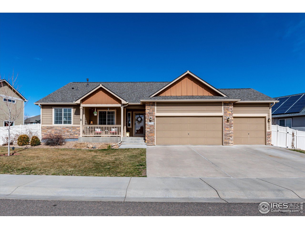 5771 Mountain Shadows Boulevard Firestone, CO 80504 - Photo 4 of 40 a front view of a house with a yard