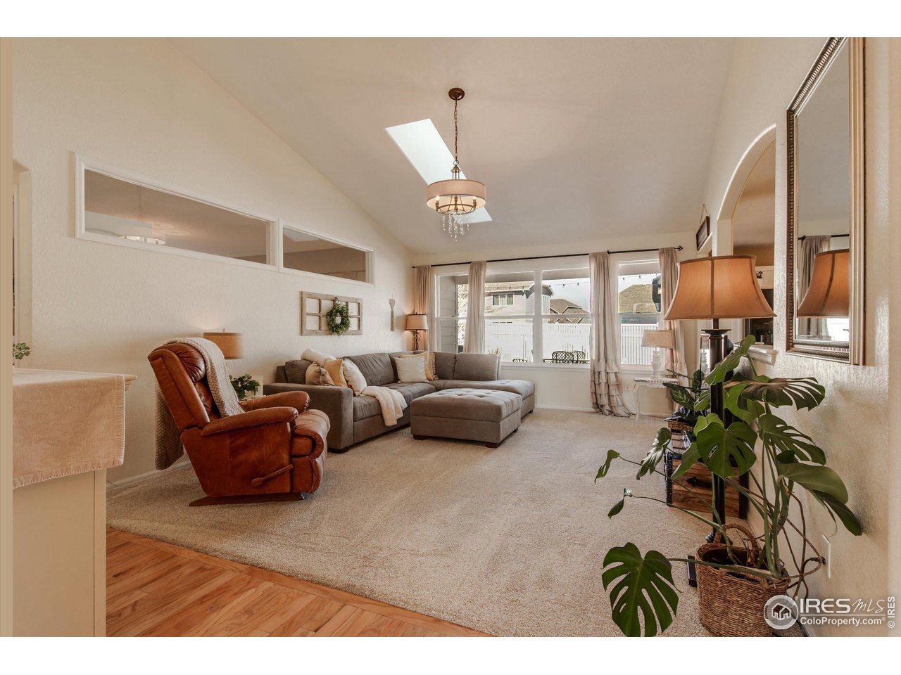 5771 Mountain Shadows Boulevard Firestone, CO 80504 - Photo 7 of 40 a living room with furniture and a large window