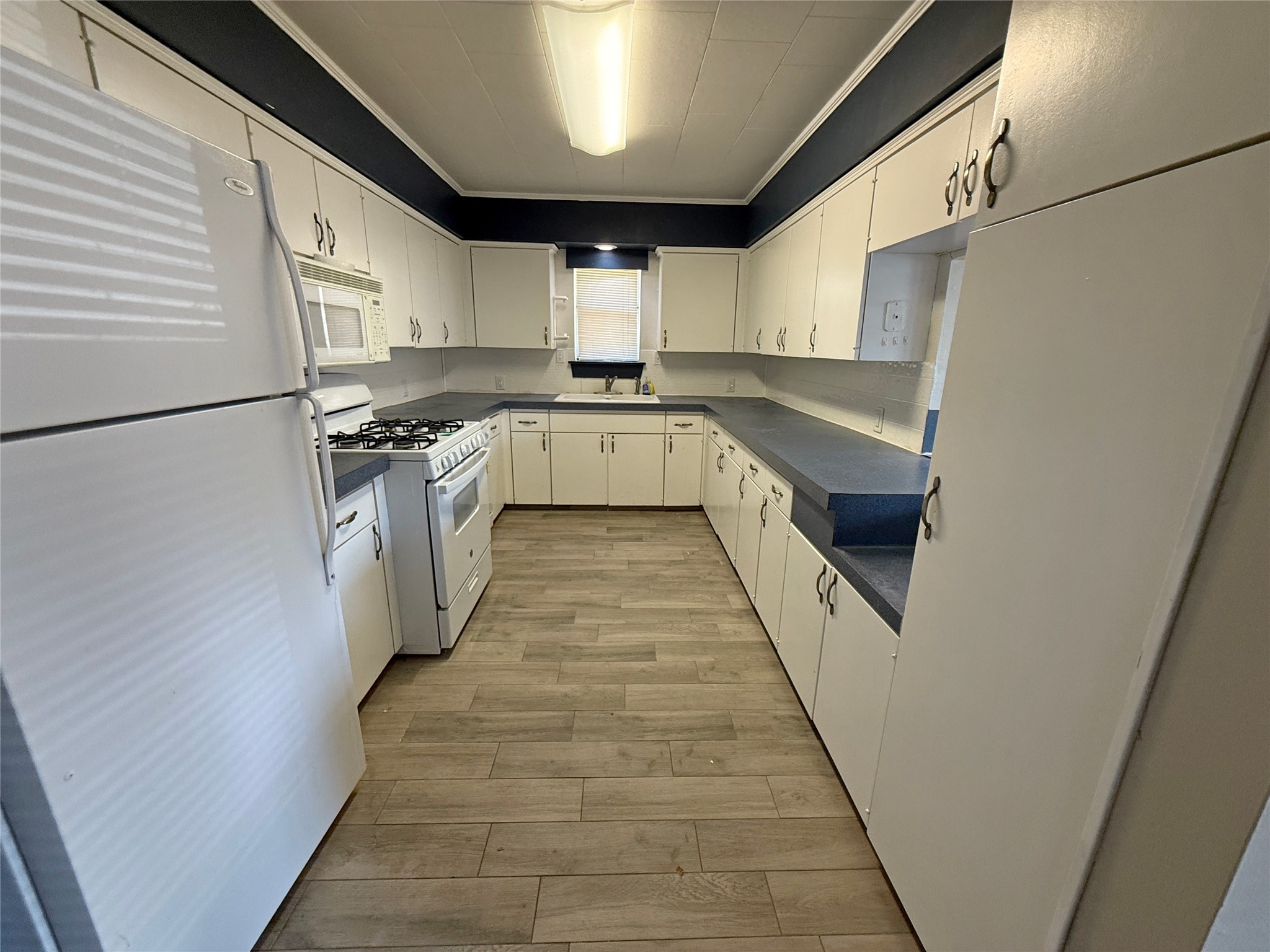508 Rals Drive Onalaska, TX 77360 - Photo 17 of 42 Galley style kitchen with pass thru to the right.