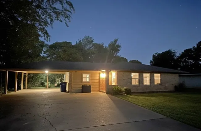 a view of house next to a yard