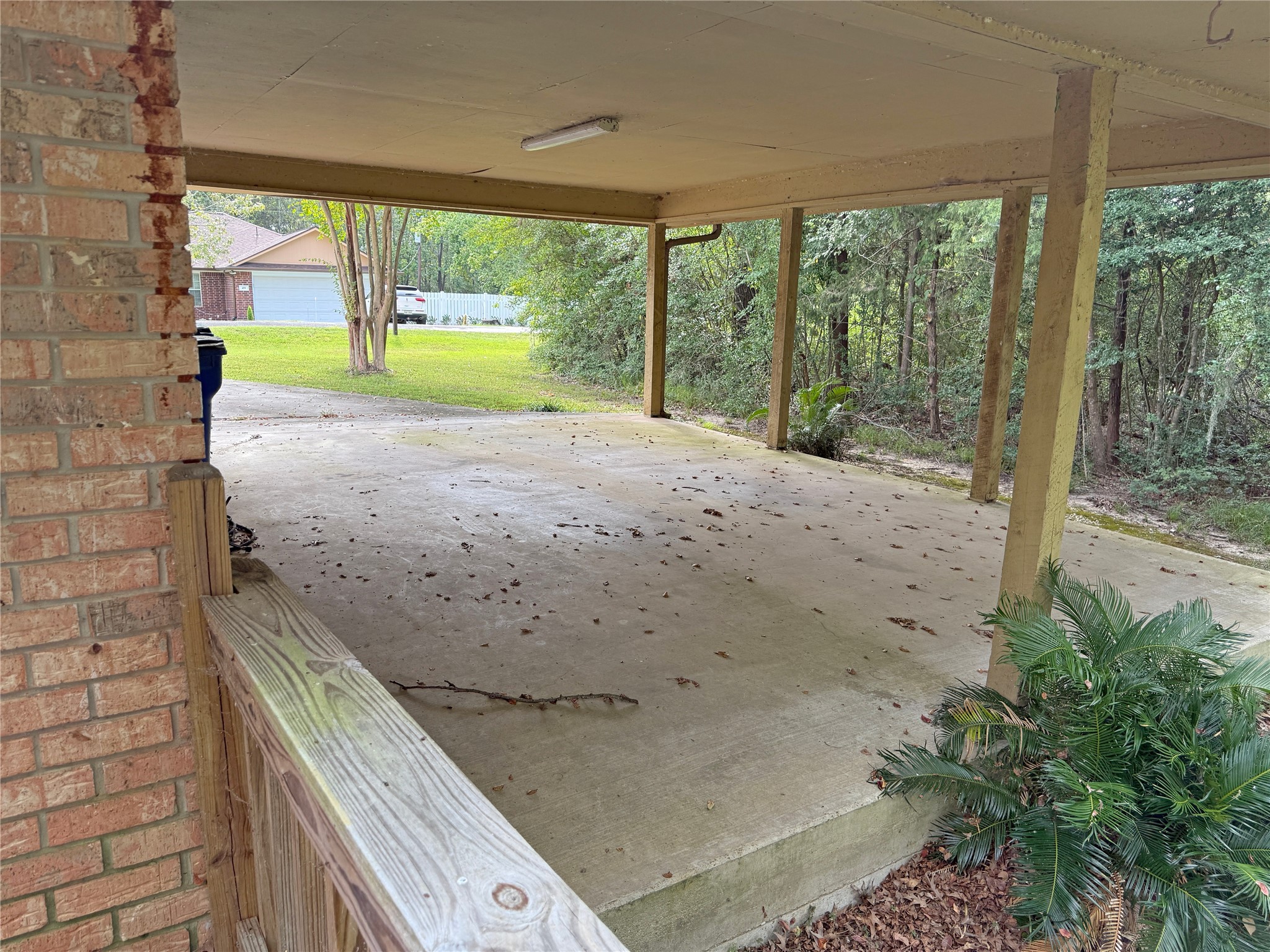 508 Rals Drive Onalaska, TX 77360 - Photo 10 of 42 Facing the carport from the deck in the back yard.