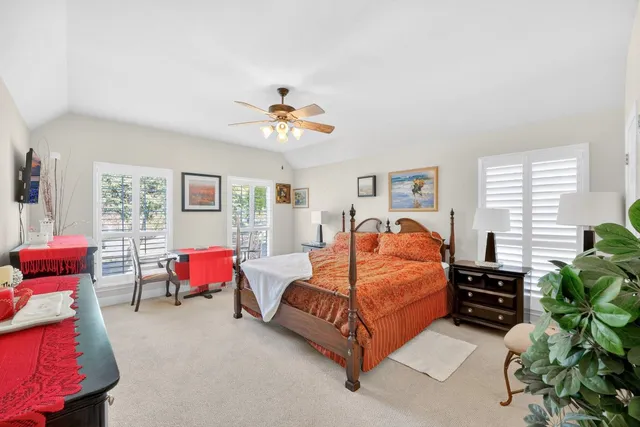 a bedroom with bed and window