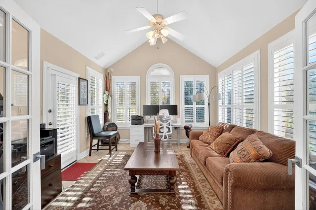 a living room with furniture and a large window
