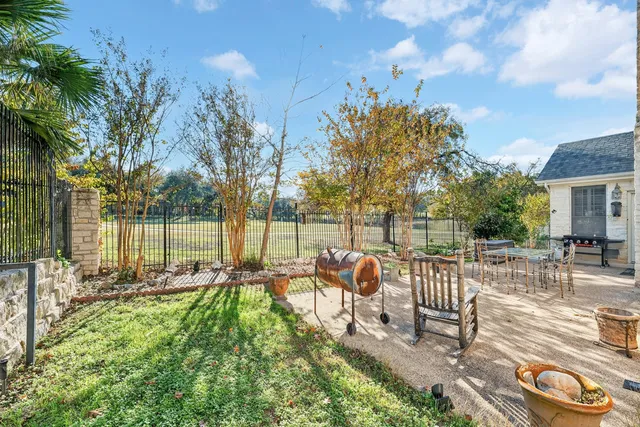 a view of a chair and tables in the patio