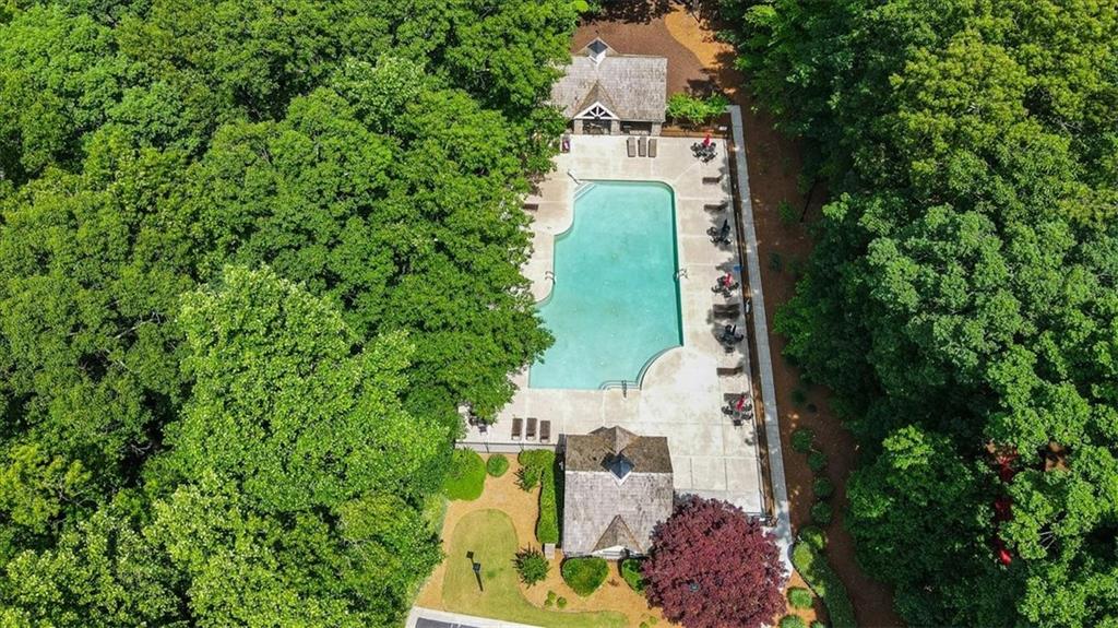 1710 Rising Mist Lane Cumming, GA 30041 - Photo 79 of 111 an aerial view of residential house with outdoor space and trees all around
