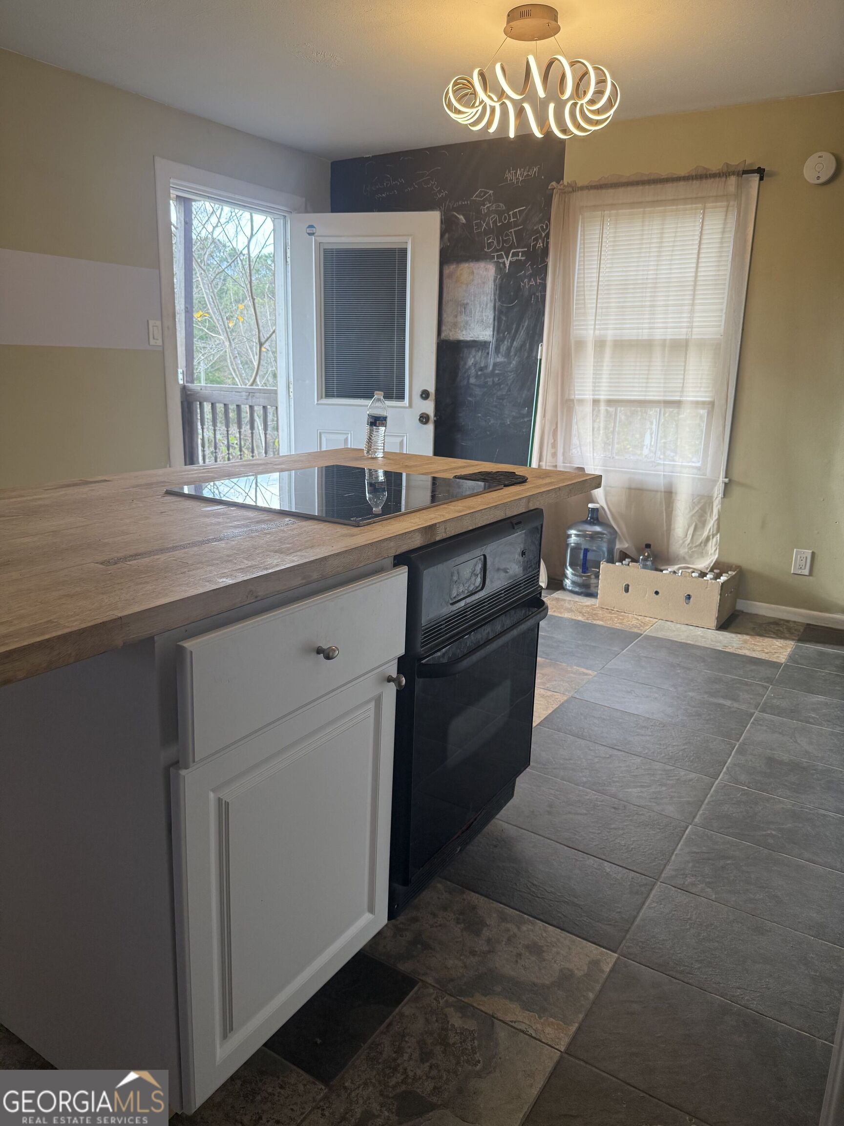 3861 Newnan Road Griffin, GA 30223 - Photo 23 of 89 a kitchen with a sink cabinets and window